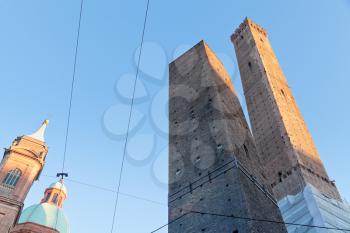 view of two tower - symbol of city under blue sky in Bologna, Italy