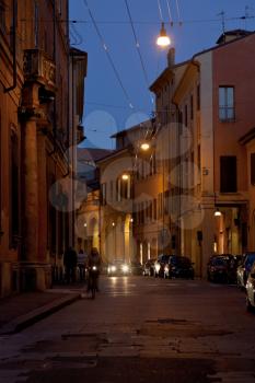 medieval street (via Barberia) in historical district of Bologna, Italy at night