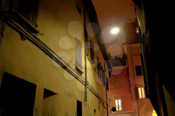 medieval street in Bologna at night, Italy