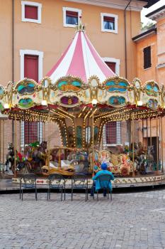 Traditional merry-go-round carousel on town square in Ravenna, Italy