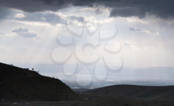 view on Dead Sea though mountain valley in cloudy evening