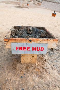stand with free mineral mud on coast of Dead Sea