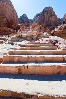 antique sandstone steps on Facade Street in Petra, Jordan