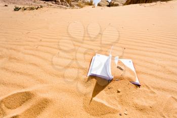 note book in red sand dune of Wadi Rum desert, Jordan