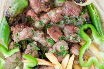 plate with arabic lamb kebab in Jordanian street restaurant