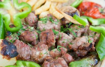 plate with arabic lamb kebab in Jordanian street restaurant
