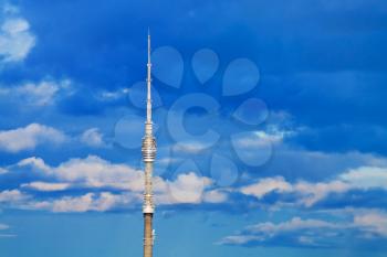 television tower with deep blue cloudy sky background