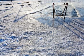 winter swimming in frozen river in frost winter day in Moscow, Russia