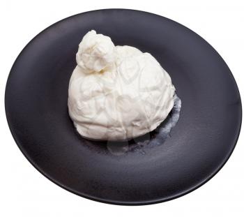 fresh italian cheese burrata on black ceramic plate isolated on white background
