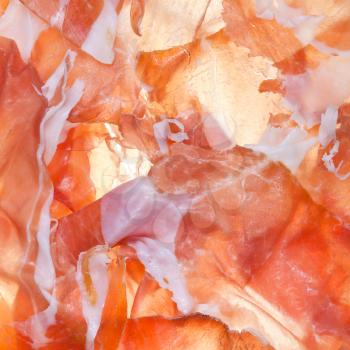 food background from sliced ham Prosciutto di Parma close up