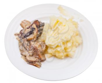 stewed mushrooms and mashed potatoes on plate isolated on white background