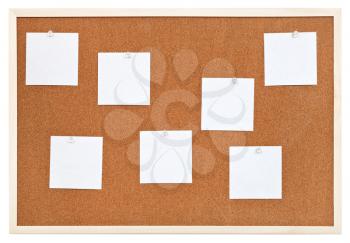 several sheets of paper on bulletin cork board isolated on white background