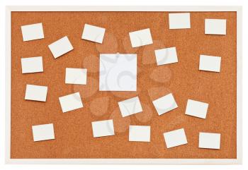 small sheets of paper on bulletin cork board isolated on white background