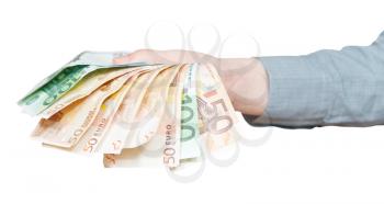 fanned euro banknotes in hand isolated on white background