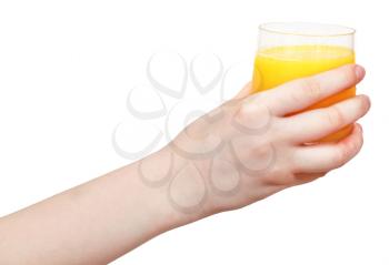 glass with fresh orange juice in hand isolated on white background