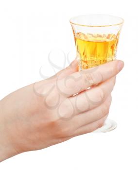 hand holds glass of dessert wine isolated on white background