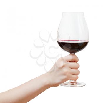 hand rises big glass with red wine isolated on white background