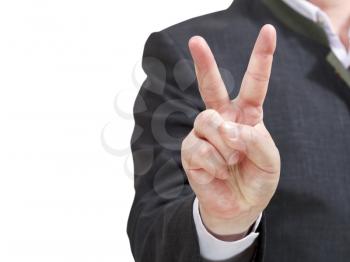 businessman holds victory sign close up - hand gesture isolated on white background