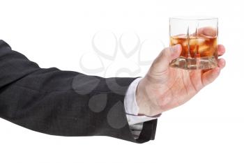 side view of whisky with ice glass in businessman hand isolated on white background