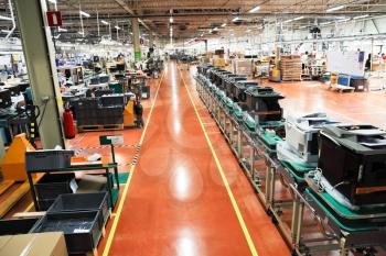 production conveyor of office devices on factory