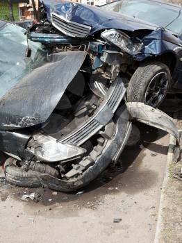 cars damaged during road accident on urban street