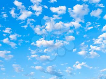 lot of small white clouds in summer blue sky