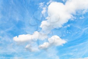 blue sky with white cumulus clouds in autumn - natural background