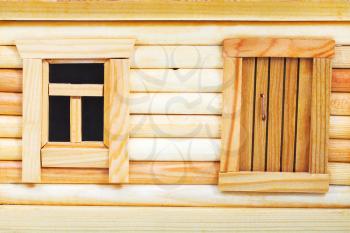 door and window of model of simple village wooden log house isolated on white background