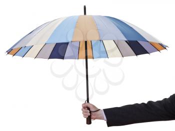 man's hand with open striped umbrella isolated on white background
