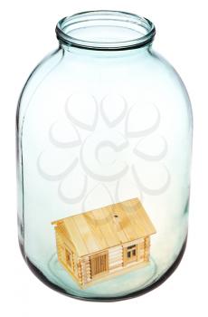 new wooden house in big open glass jar