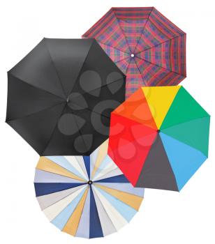 four different open umbrellas isolated on white background