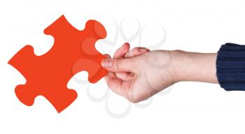 female hand with red puzzle piece isolated on white background