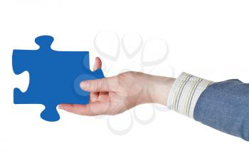 male hand with blue puzzle piece isolated on white background