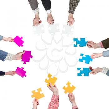 four sides with people hands holding puzzle pieces isolated on white background