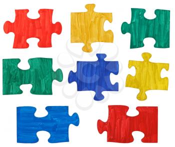 set of colored painted puzzle pieces isolated on white background