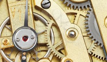 brass mechanical movement of vintage clock close up