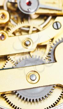 background from brass mechanical clockwork of vintage clock close up