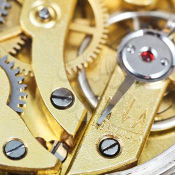brass mechanical movement of retro clock close up