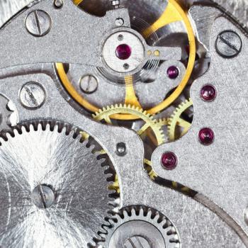 background from steel mechanical clockwork of retro watch close up