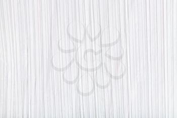 background from sheet of white light colored corrugated paper close up