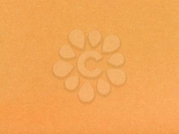 background from sheet of orange brown color pastel paper close up