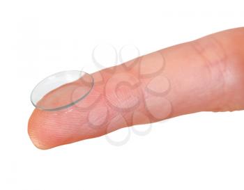 contact lens on finger close up isolated on white background