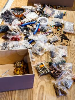 findings for beads making on table in workshop