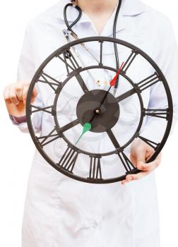 nurse holds big clock isolated on white background