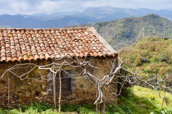 old abandoned country house in Sicilian mountains in spring