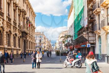 CATANIA, ITALY - APRIL 5, 2015: view of via Etnea and Etna volcano in Catania, Sicily, Italy. Etnea is the main street of historical center of Catania, it is about three kilometers long.