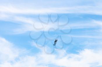 blue sky with white clouds and military fighter aircrafts