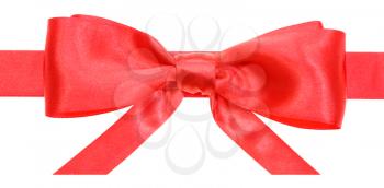 real red satin bow with horizontal cut ends on ribbon close up isolated on white background