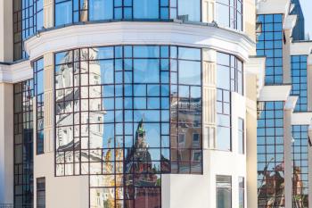 Moscow cityscape - reflection of historic Moscow Kremlin towers in mirrow windows of modern building