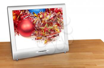 Christmas still life with red ball and star on screen of TV set isolated on white background